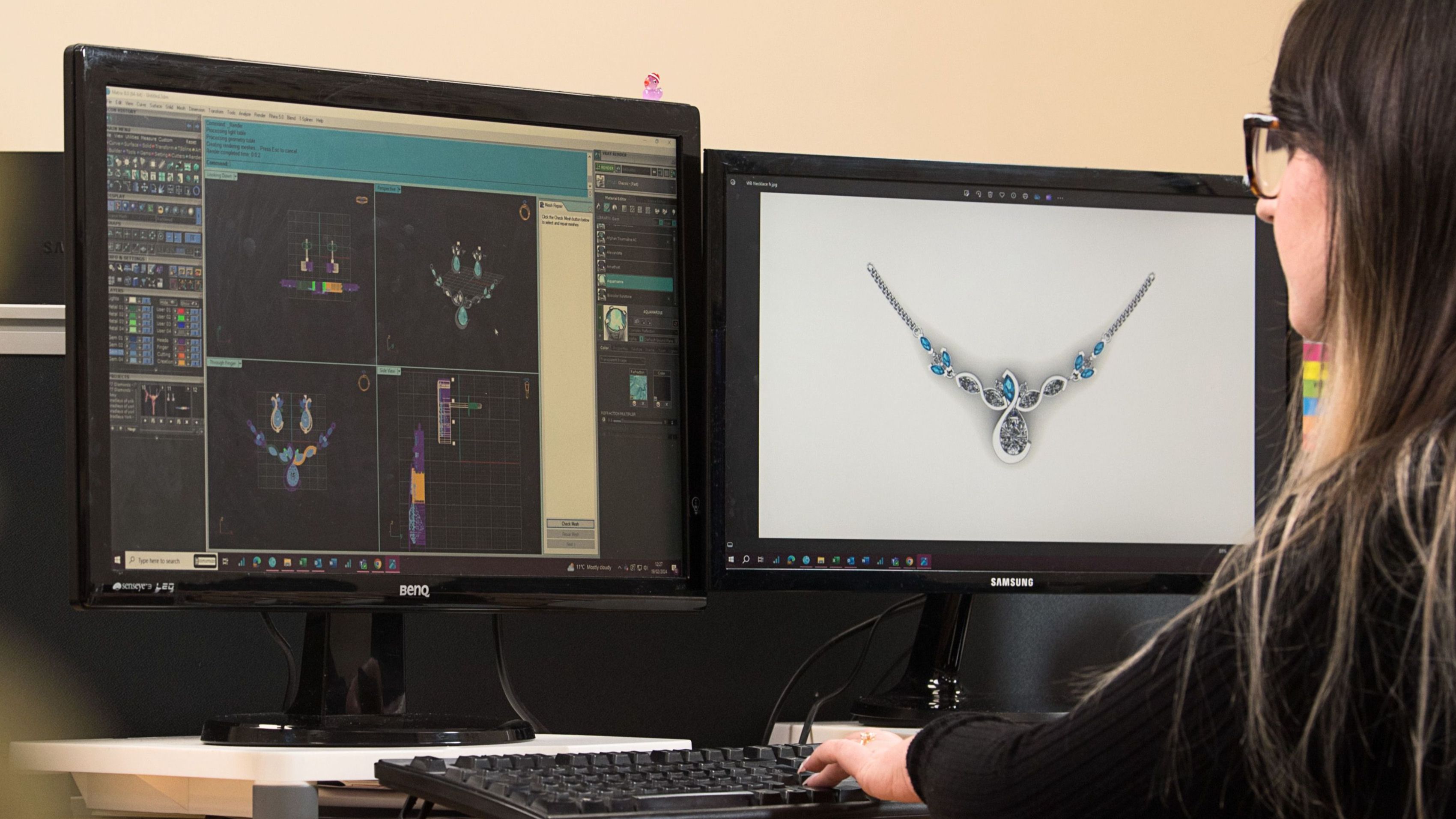 an individual looking at dual screens assessing renderings of jewellery
